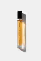 Perfume bottle with a black cap on a light gray background