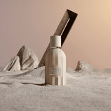 Beige bottle with a desert landscape background