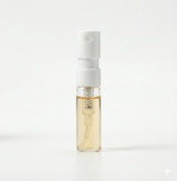 Small spray bottle with a white cap and clear body on a white background